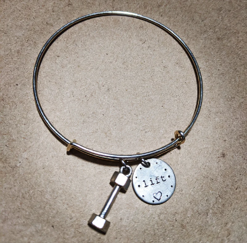 Dumbbell Lift with Heart Bracelet